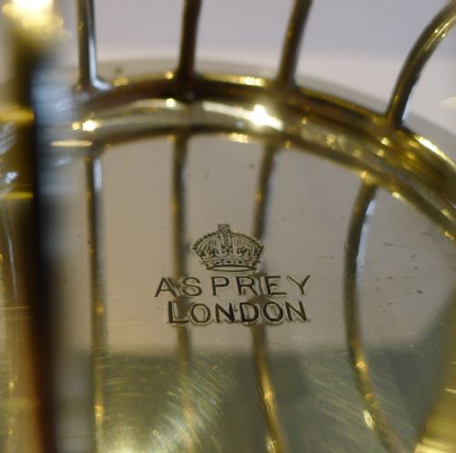 Two Edwardian silver warming toast racks, Asprey & Co., London 1907 and  1909, Easter Feast, 2022