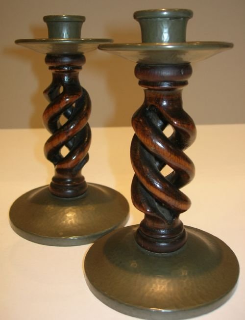 pair liberty tudric arts and crafts candlesticks pewter and oak