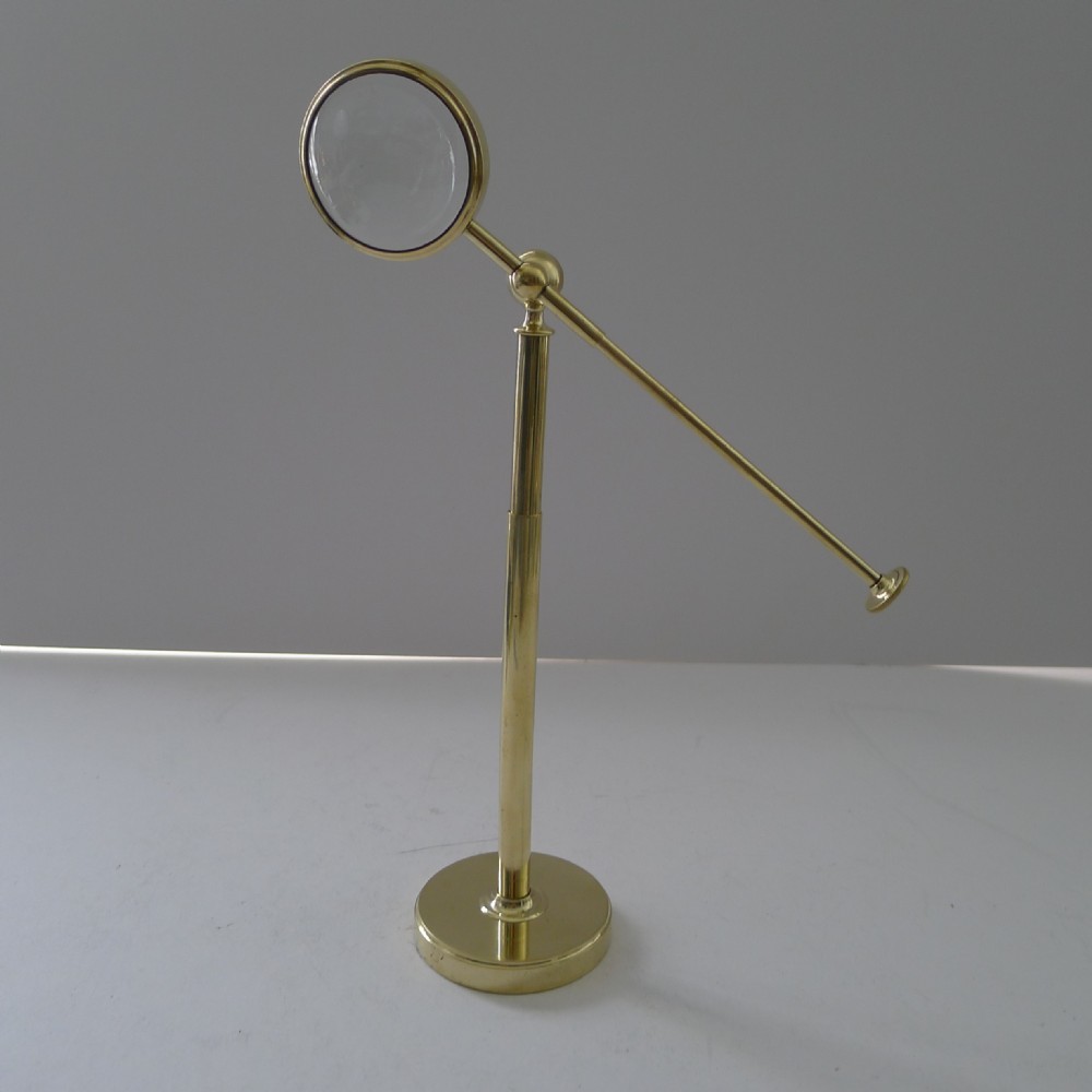 brass pivoting bullseye magnifying glass lens on stand c1915