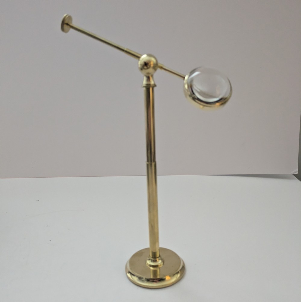 brass pivoting bullseye magnifying glass lens on stand c1915